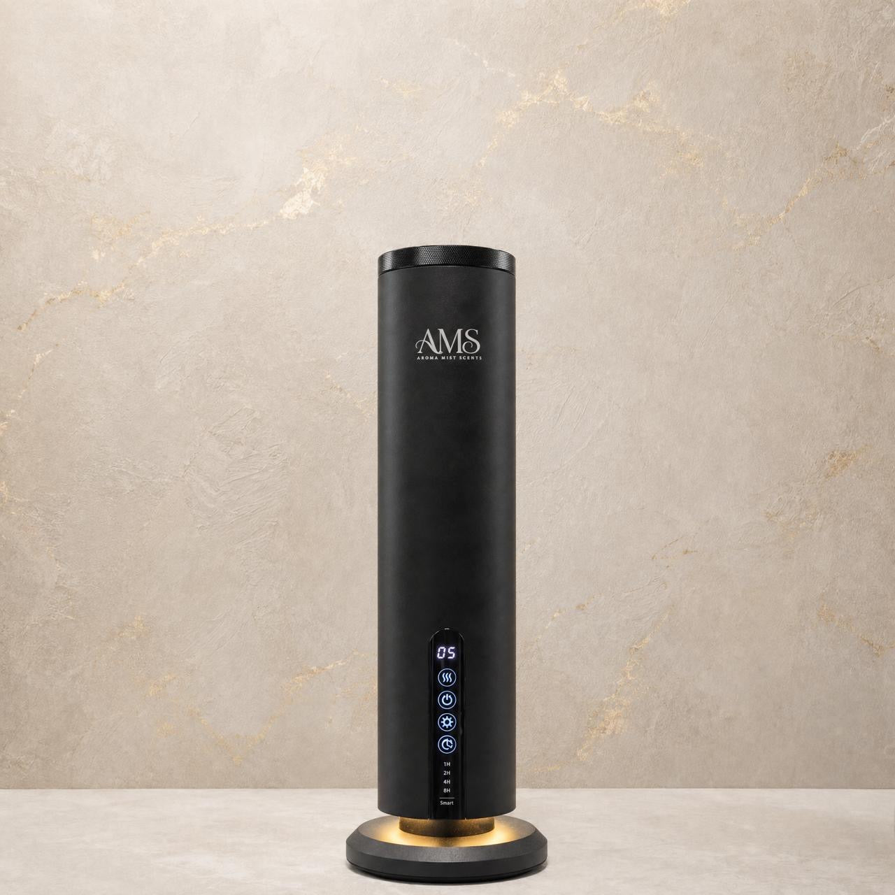 A sleek black cylindrical AMS diffuser with a glowing circular base, standing on a light stone surface against a textured beige wall.